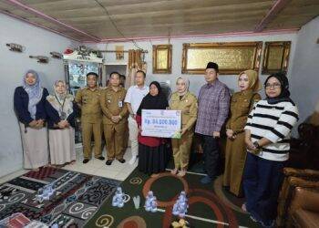 Pj Wali Kota Jambi Serahkan Santunan JKM